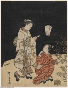 Young Man And Woman Hunting For Insects At Night