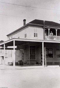 Stiglich Grocery, Mrs. Stiglich's Father In Law And Mother In Law On Upper Porch, 1932, From The Corner Stores Of Galveston, Galveston County Cultural Arts Council — Betty Tichich
